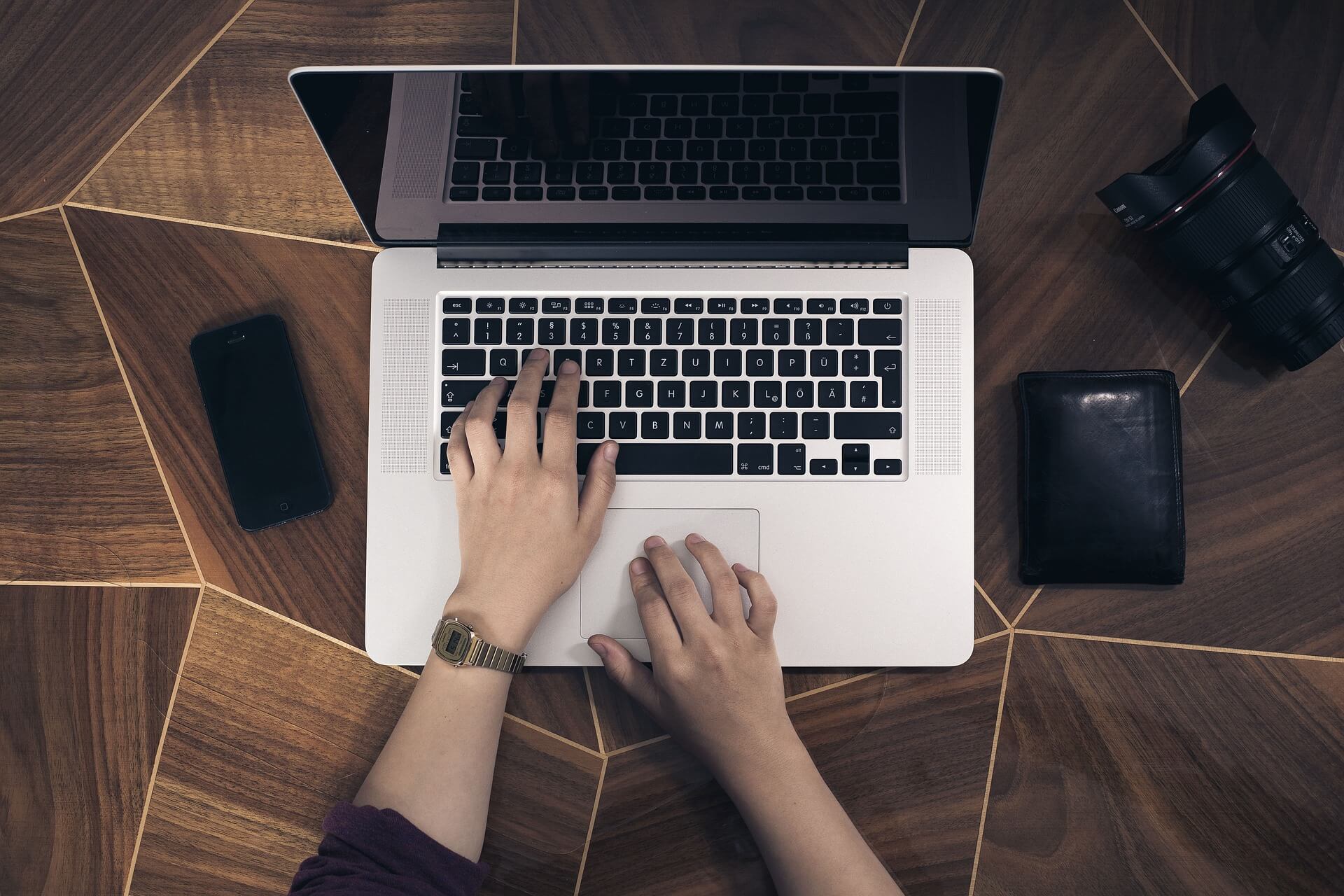 Typing on a laptop keyboard with focus